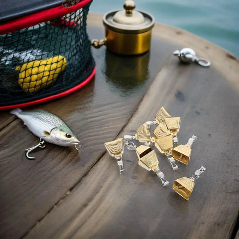 Stainless Steel Fishing Rod Bite Alarm Bells with Clips 15 Piece Set of Indicators for Freshwater and Saltwater Use on wooden surface