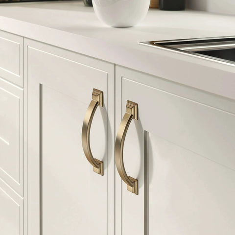 Brushed brass cabinet pulls on white kitchen cabinets, part of the 10 Pack Brushed Brass Cabinet Pulls 3 Inch Hole Center 4.4 Inch Overall Length.