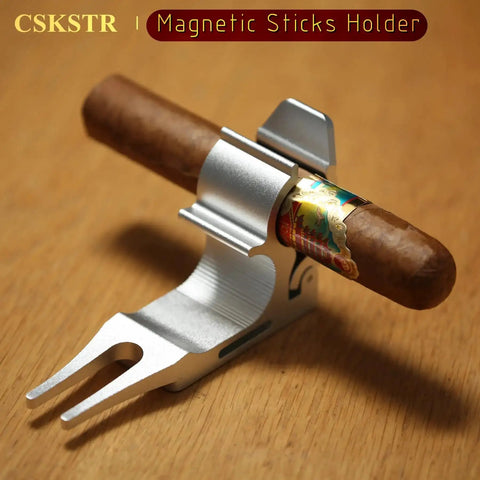 2 Pack Magnetic Sticks Holder For Golf Cart And Grass With Four Point Lock And Sponge Pad Protection in use holding a cigar