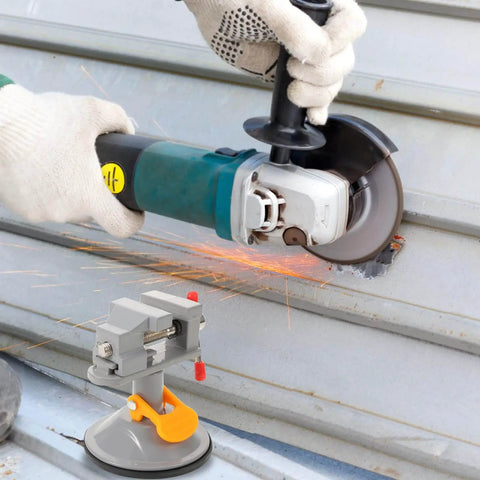 Multi Functional Rotating Bench Vise With Swivel Tabletop Clamp for woodworking and DIY projects shown with angle grinder in use