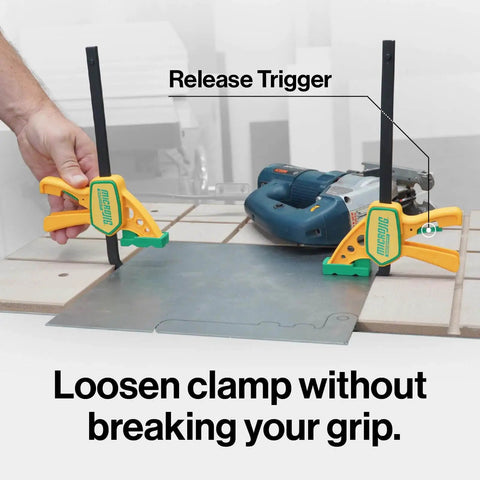 Grr-rip Grip-Strong Dovetail Clamps Two-Pack For Woodworking Jigs And Sleds holding metal sheet, T-track compatible, yellow.