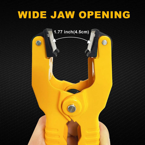 Yellow HVAC temperature clamp with wide jaws for K-type thermocouples, held in hand