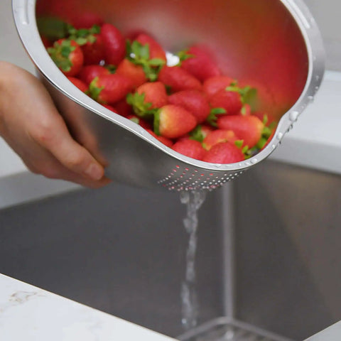 Stainless Steel Rice Washer Strainer Bowl With Agitator Bumps, rust-resistant colander rinsing strawberries over sink, meal prep