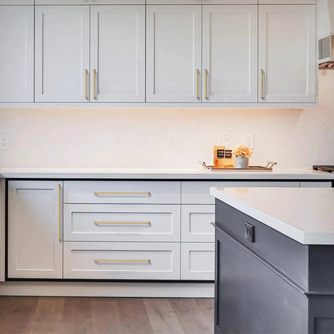 Champagne Bronze Cabinet Pulls 10 Pack 5 Inch Center To Center 128mm installed on white kitchen cabinets and drawers.