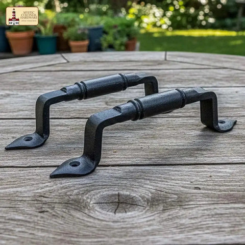 Mystic Colonial Rustic Cast Iron Barn Door Handles Set Of 2 In Black Finish on wooden table, ideal for gates and garden doors.