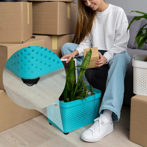Woman moves blue storage box with Self Adhesive Caster Wheels Set 16 Pieces With 360 Degree Swivel Mini Appliance Rollers