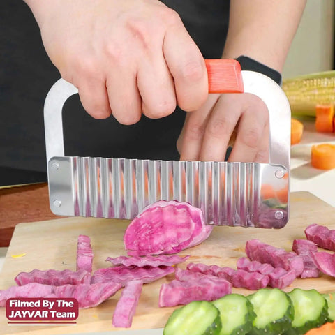 Person using Extra Large Crinkle Cutter Wave Potato Slicer for restaurants and home kitchens on purple vegetables