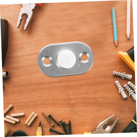Sliding Door Floor Guide Roller And Barn Door Stopper hardware piece on wooden surface with tools around