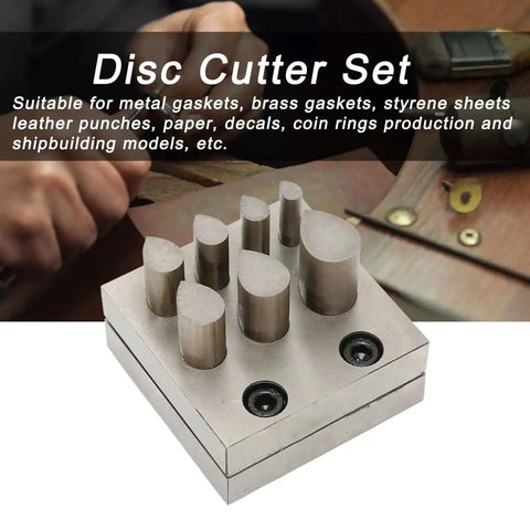 Pro Grade Disc Cutter Set For Jewelry Making, showing 7 size punch die plates with flat bottom on a workbench.