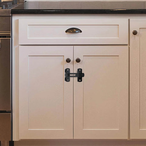 4 Pack 180 Degree Flip Sliding Barn Door Latches Stainless Steel Gate Locks installed on kitchen cabinet doors.