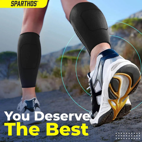 Person running outdoors wearing calf compression sleeves for men and women unisex leg support in black XL for shin splint relief.