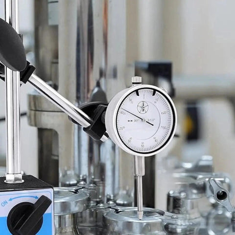 Pro Grade 0-1 Inch Dial Indicator with Magnetic Base and Adjustable Long Arm in use on metal equipment for precise measurement.