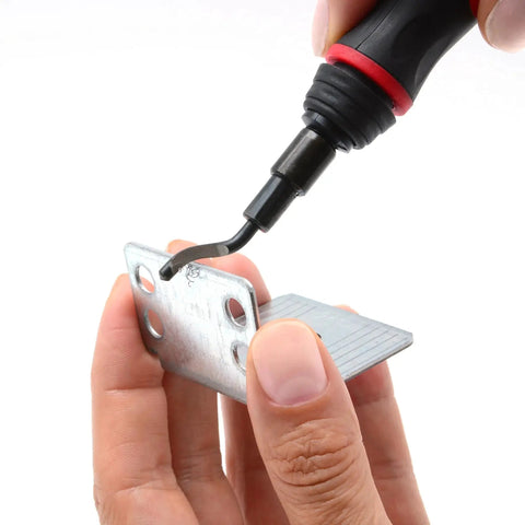 Using the Extendable Neck Deburring Tool With Swivel Head And 4 Blades For Metal Plastic PVC Copper Resin And 3D Printed Edges Long Reach Up To 2 Inches Pro Grade Burr Removal For Plumbing And 3D Printing on a metal piece.