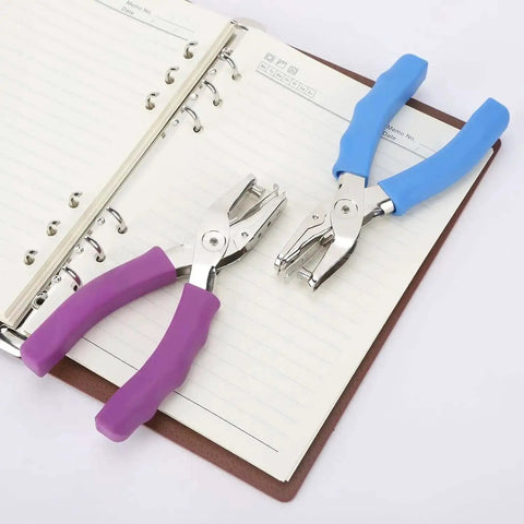 Two one quarter inch single hole punches with soft grip handles, 6 sheet capacity, on notebook pages, pack of 3, ideal for labels and cards.