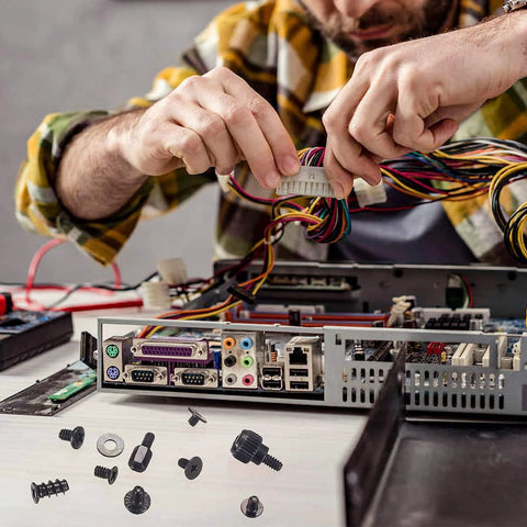 Man assembling PC with 420 Pcs Computer Screws And Standoffs Kit for motherboard, laptop, PC case, HDD, and SSD installation