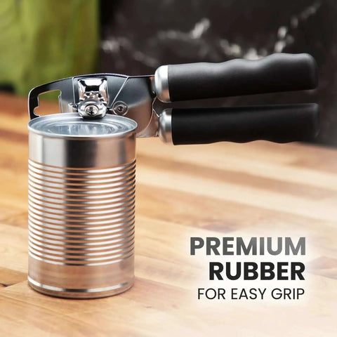Comfy Manual Can Opener With Bottle Opener, Rust Proof Stainless Steel, Turn Knob, Soft Grip Handles shown gripping can on kitchen counter