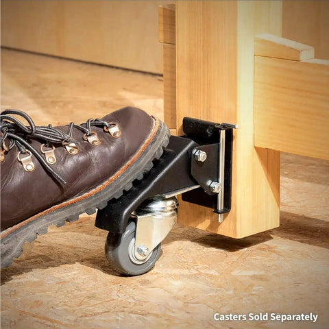Foot engaging pin-release mechanism on quick-release workbench caster plate, showcasing smooth lateral release and hardware assembly