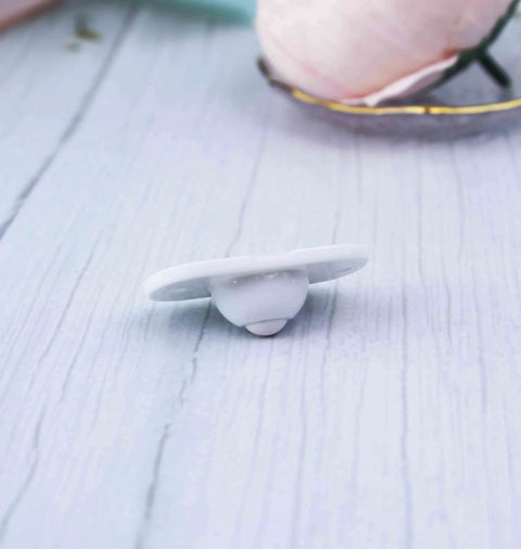 Close-up of a single white nylon 4 Pcs Self Adhesive 360 Degree Swivel Caster Wheel with durable ABS construction and steel ball bearings.