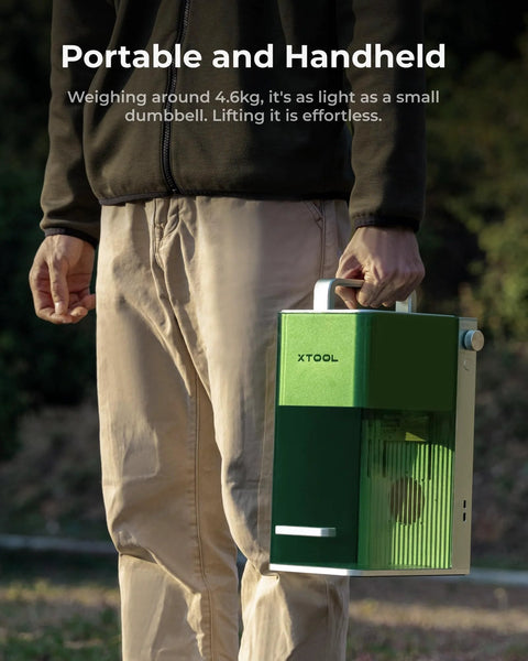 Person holding portable Lightning Fast 4000mm Per Second Laser Engraver For Wood Leather Acrylic Glass Portable F1 Lite By XTool