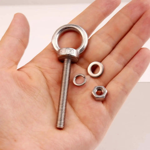 Hand holding 10 Pack M6 x 50mm Eyebolts With Nuts And Washers, Stainless Steel Marine Grade Shoulder Eye Bolts for outdoor projects.