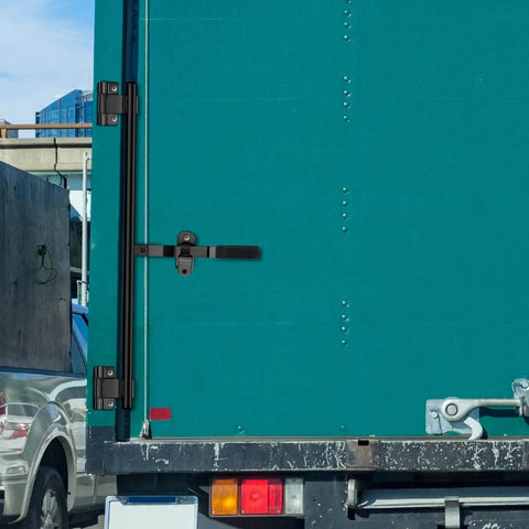 Robust stainless steel cam bar lock delivers secure, corrosion resistant latching for enclosed trailers, side view.