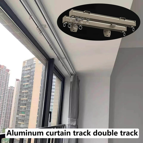 Heavy Duty Curtain Track System With Double Ceiling And Wall Mount Quiet Rollers For Room Divider And Sliding Doors In Champagne Finish Ideal For Living Room Bedroom And Closet 4.7 Meter Length Or 15.4 Feet installed on window with city view.