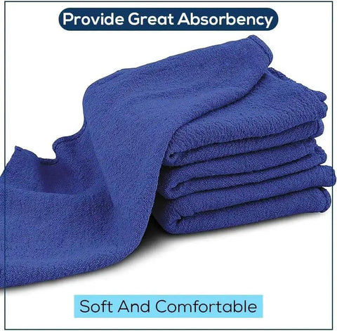 Stack of blue cotton towels labeled '90 Pack Blue Cotton Shop Towels 14 By 12 Inches Reusable Rags For Auto Garage Industrial And Home Cleaning'