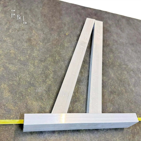 Heavy Duty Aluminum Square Duct Angle Cutting Guide with exact 15 and 22.5 degree markings on a surface, for HVAC ductwork and sheet metal.