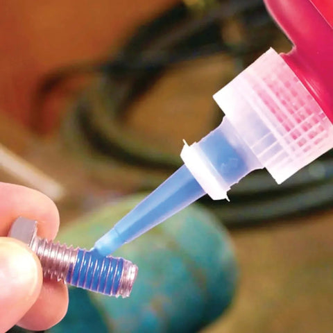 Applying Blue Removable Thread Locker, Medium Strength 242 Series, 10 mL Bottle to bolt threads to prevent loosening from vibration.