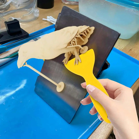 Using Must-Have 7-Piece UV Resin 3D Printer Cleaning Kit with silicone spatula to remove print from build plate