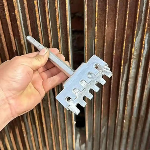Hand holding Square Hole Cutter Kit For 86-Type Electrical Junction Boxes, heavy-duty tool in front of rusty metal background