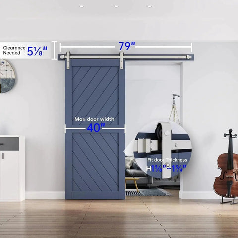 Installed brushed nickel sliding barn door hardware track kit, heavy duty rollers, 40-inch width, blue door in living room.
