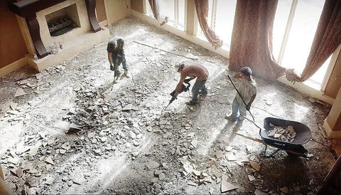 Workers using SDS Max Floor Scraper Heavy Duty Beast Pro Tool with 2.5 mm blade for fast concrete demo in a large room.