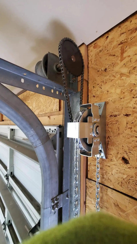 Close-up view of Garage Door Jackshaft Chain Hoist 3 To 1 Reduced Drive For Roll Up Doors, showing chain and sprocket detail.