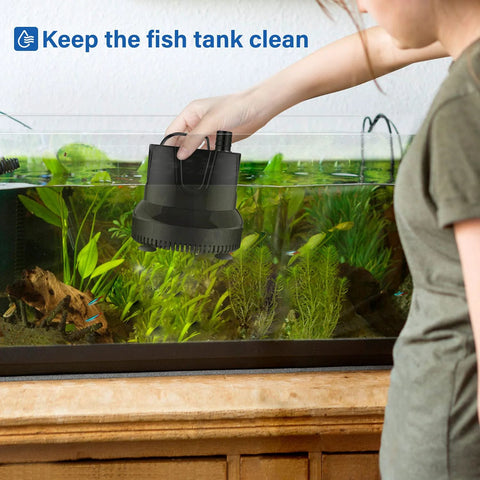 Hand-held view of Simple Deluxe 660GPH bottom-suction submersible water pump, black, near a fish tank.