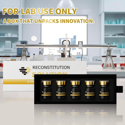 Five 5mL glass vials with gold caps in a black tray for lab use.
