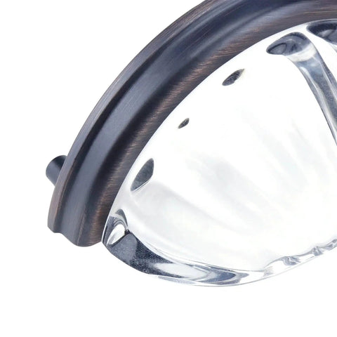 Close-up of Three Inch Hole Centers Clear Glass Cabinet Cup Pulls with Scalloped Crystal Glass and Oil Rubbed Bronze Base.