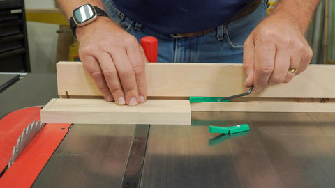 MicroJig MatchFit Pop Stop 6-Pack installed on a table saw with a wooden board, showing auto retract function and custom screwdriver.