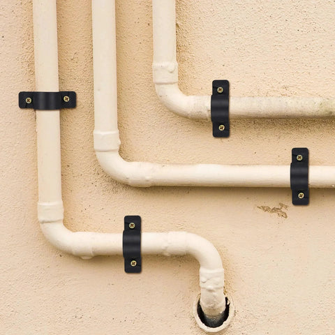 50 Pack Half Inch Pipe Supports Clamp Set With Screws For PEX Copper And CPVC Tubing Suspension Mounts Must Have Great For Organizing Messy Pipes In Home Plumbing Projects Durable Construction For Long Lasting Use And Easy Installation installed on wall.