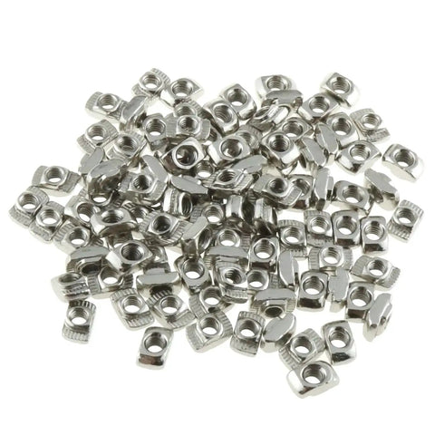 Heavy Duty M4 T Slot Nuts Set 100 Pieces Nickel Plated Carbon Steel Half Round Sliding Fasteners For 2020 Series Aluminum Extrusion Profiles And DIY Projects Built To Last shown in a pile