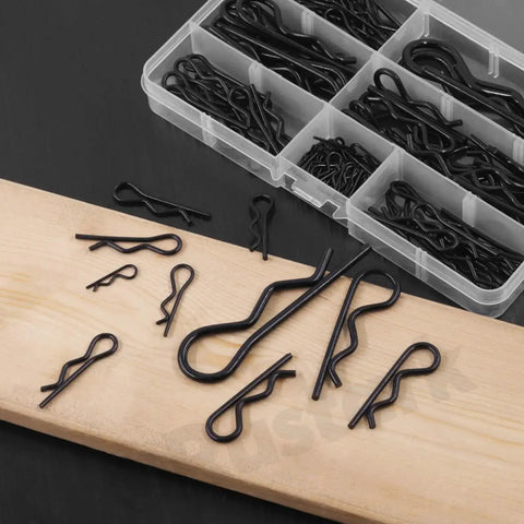 Six Sizes Black Zinc Plated Hitch Pins R Clips Kit with 145 pcs, visible in a clear organized storage box, on a wooden surface.