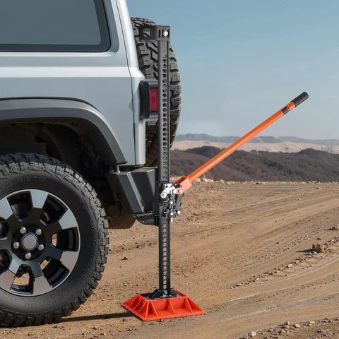 Ratcheting Off Road Farm Jack 7000 Lb Capacity 5.12 To 42.5 In Lift Range lifting vehicle on rugged terrain