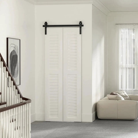 30 Inch Bi Folding Sliding Barn Door Hardware Track Kit with smooth quiet operation side mounted black rollers installed in living room