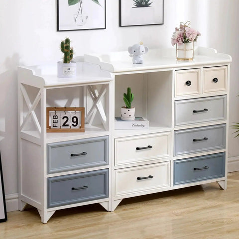 Modern dresser with multicolored drawers and decorative items on top, featuring matte black cabinet pulls.
