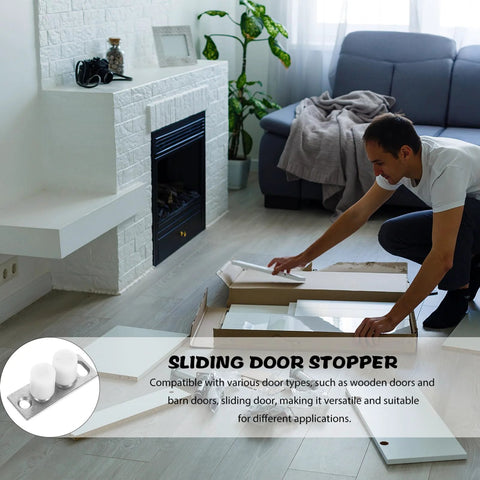 Man assembling Barn Door Roller Guide And Floor Guide Kit for smooth quiet glide operation in living room next to sofa.