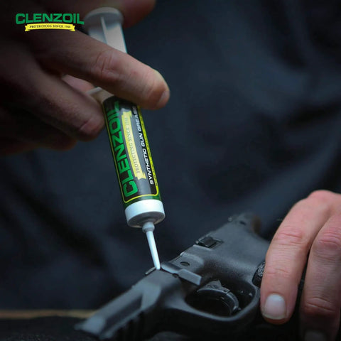 Synthetic Gun Grease Syringe For All Types Of Firearms And Guns, Heavy Duty Lubricant That Stays Put In Extreme Temperatures, Rust Prevention And Smooth Operation, Ideal For Gun Maintenance, 0.5 Oz being used on a firearm.