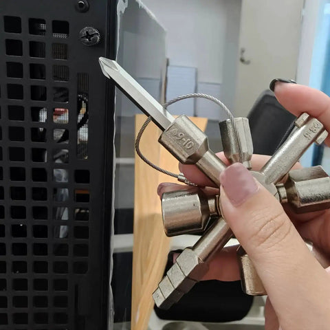 Hand holding All In One 10 In 1 Carbon Steel Portable Screwdriver And Wrench Kit for control cabinets in action