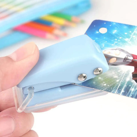 Three Piece Mini Hole Puncher Set With Six Sheet Capacity Each for ID cards and crafts, blue puncher in use