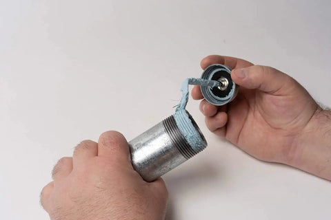 Applying Megaloc Multi-Purpose Thread Sealant Can Blue Liquid Paste 8 Oz 236 Ml One Half Pint Kevlar Reinforced No Odor Non Flammable on metal pipe
