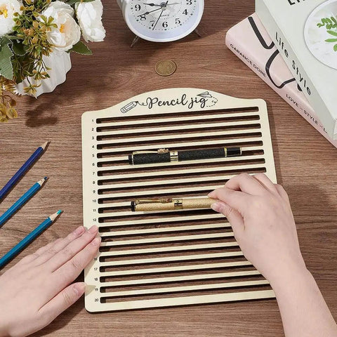 Person using 20 Slot Laser Engraving Jig For Pencils, Wood Pencil Fixture And Multi Pencil Clamping Tool for precise alignment on desk